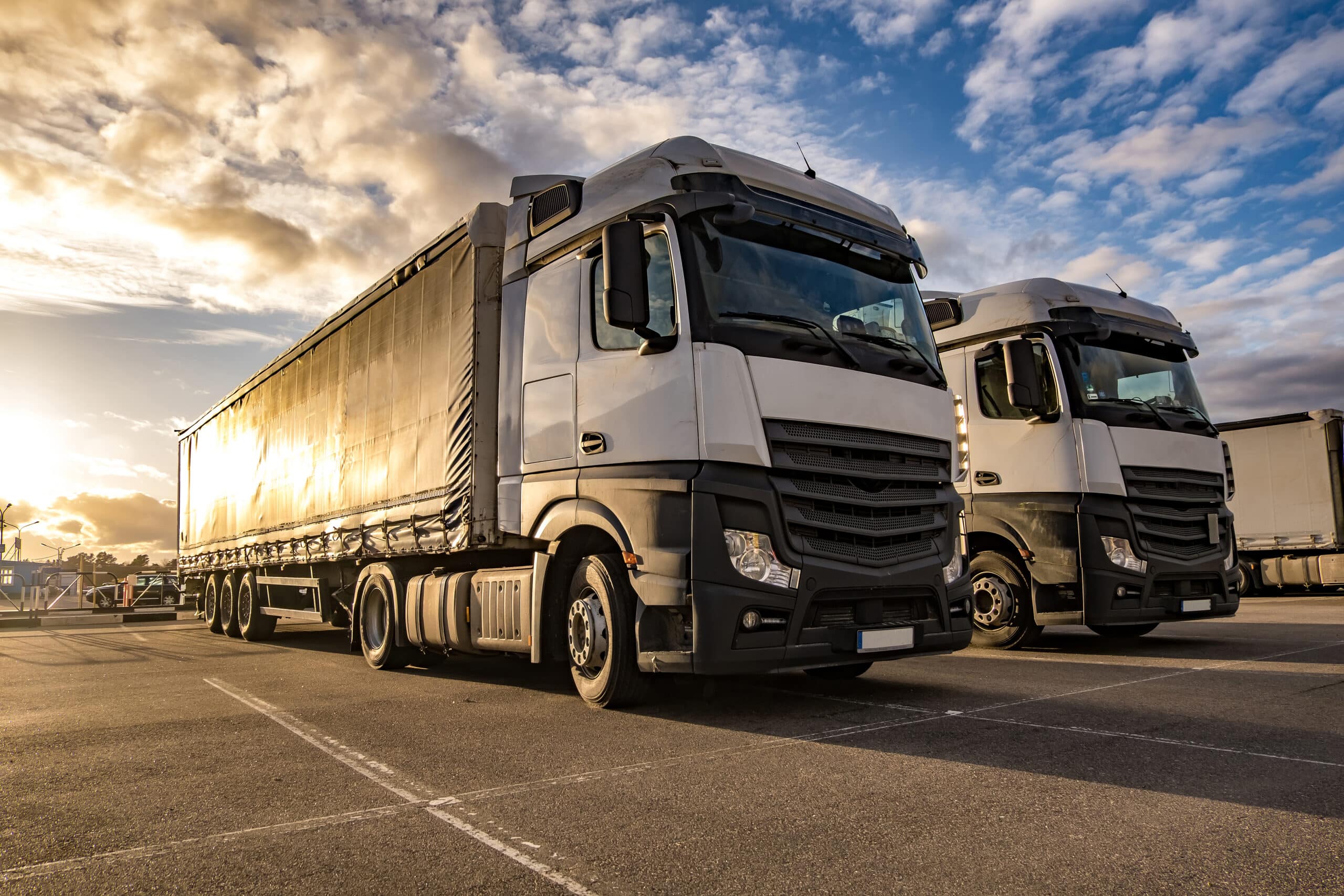 Trucks in a row with containers in the parking lot. Logistic and Trucks in a row with containers in the parking lot. Logistic and