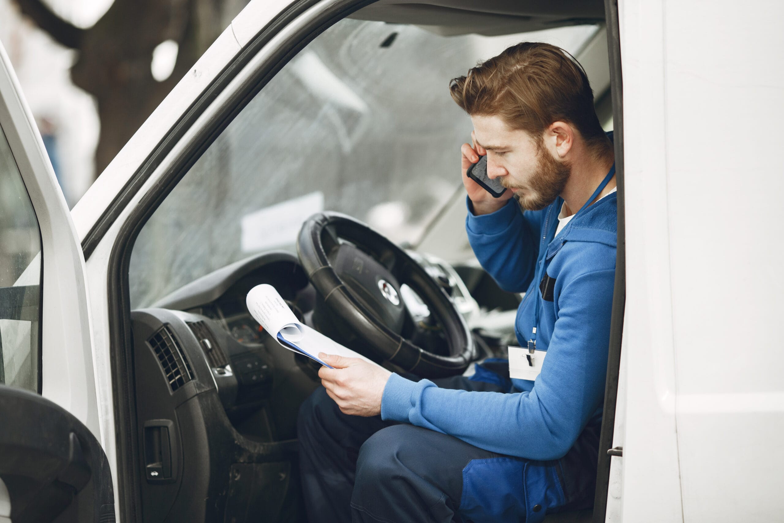 Delivery man with package outdoors Delivery man with package outdoors